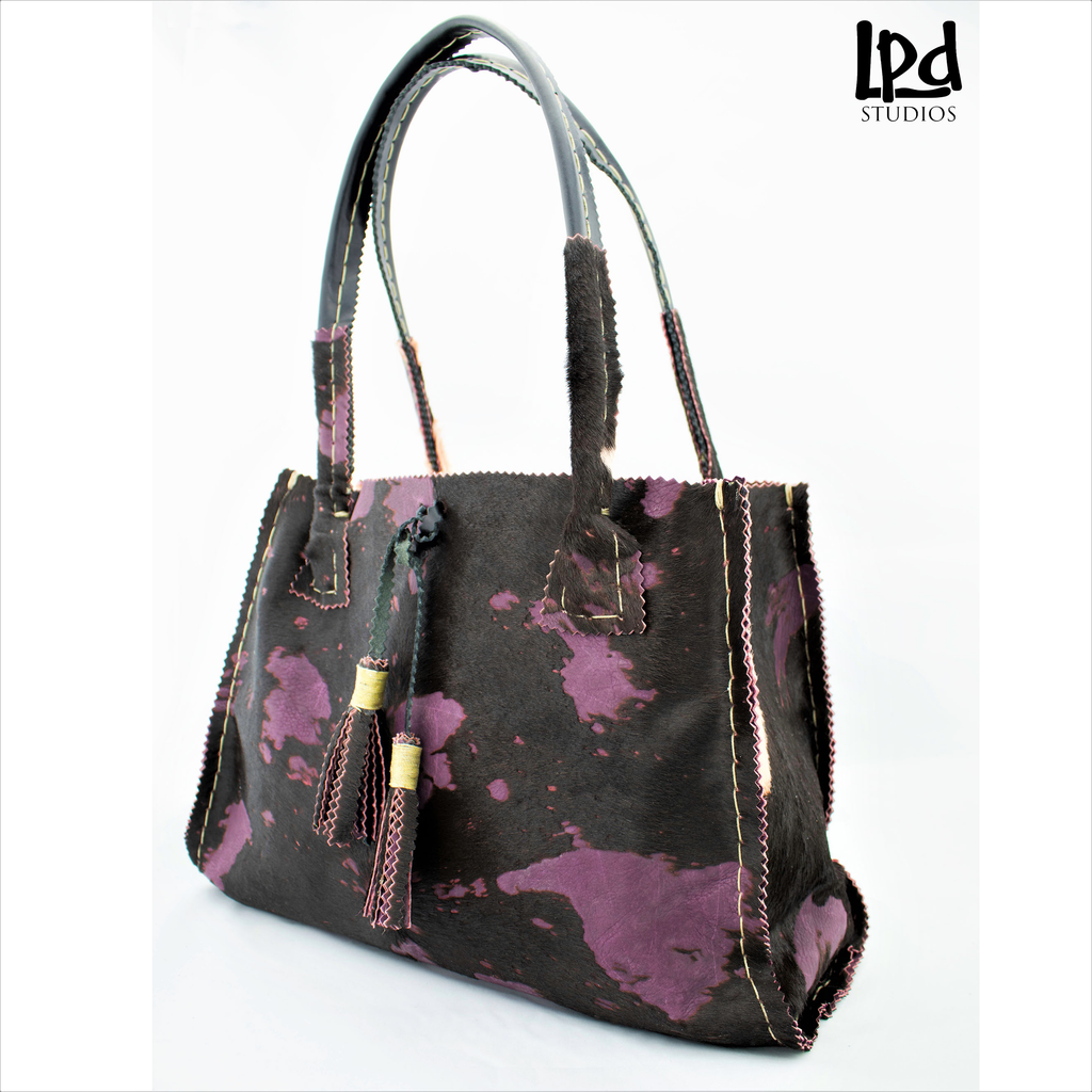 Overdyed Purple Plum Brindle Fur Leather Tote with Tassels - LPDstudios was created by designer artist Lisa Parmer Ditty. All of her designs are handcrafted in her Pennsylvania studio. She has merged her love of leather, metal and metal clay to create a u