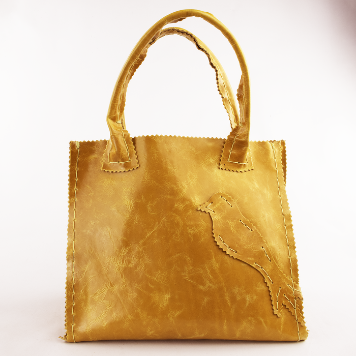 Distressed Honey Brown Leather Tote with Bird Motif.